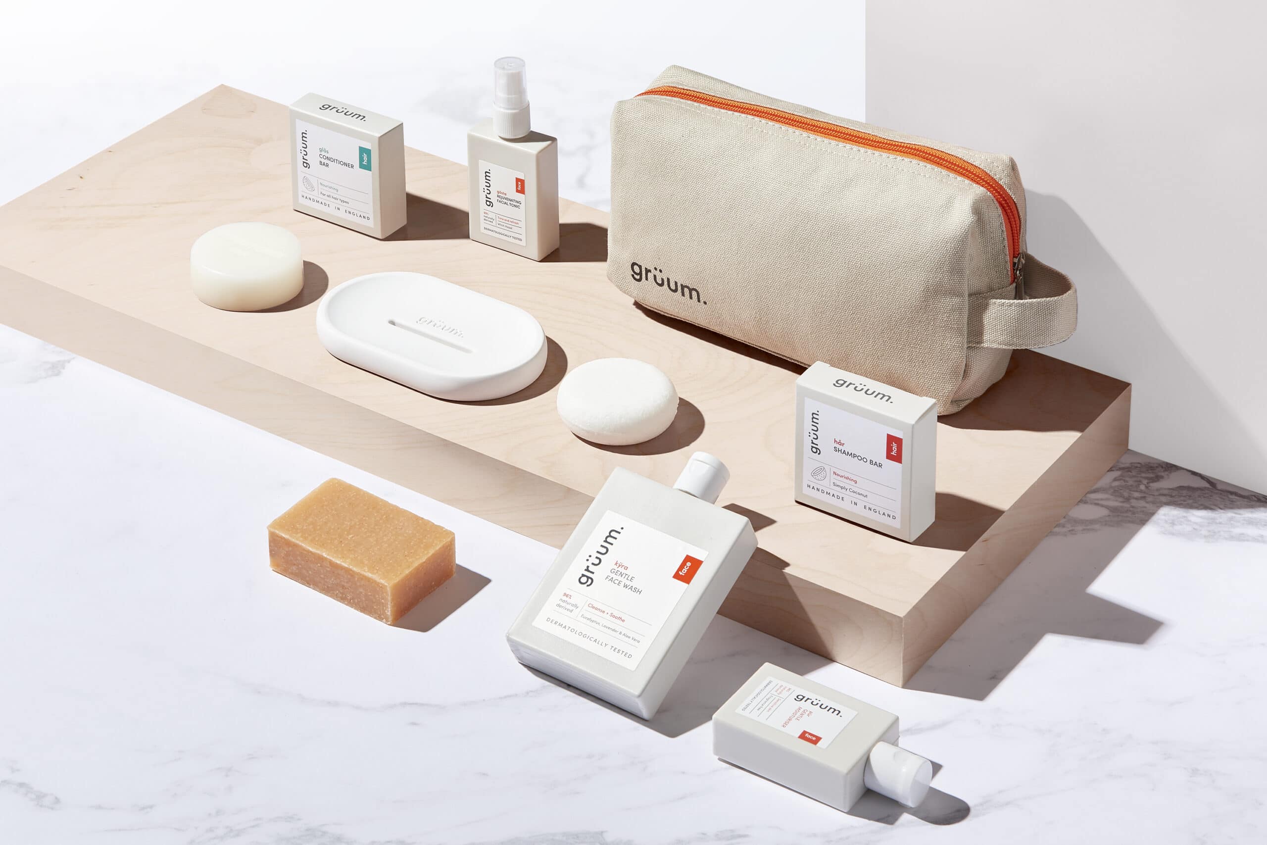 Gruum travel kit gift set product image with washbag, kyra face wash, shampoo bar, conditioner bar, pur moisturiser, body bar, gosta facial tonic and white halla soap dish